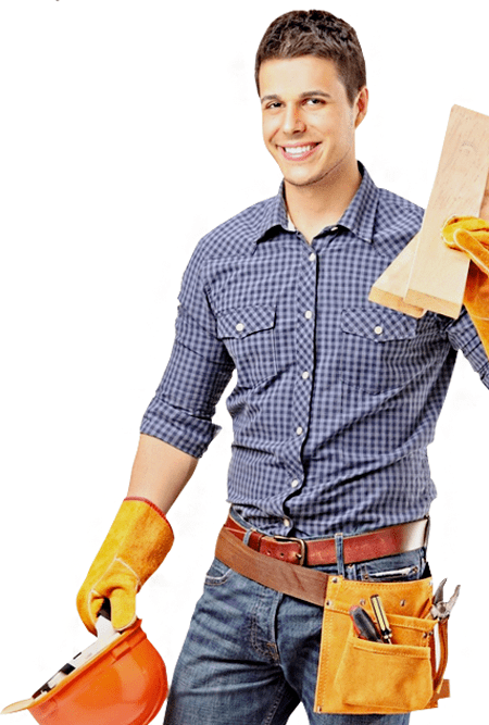 Smiling young man in plaid shirt and tool belt holding a hard hat and wood plank, standing against a white background.